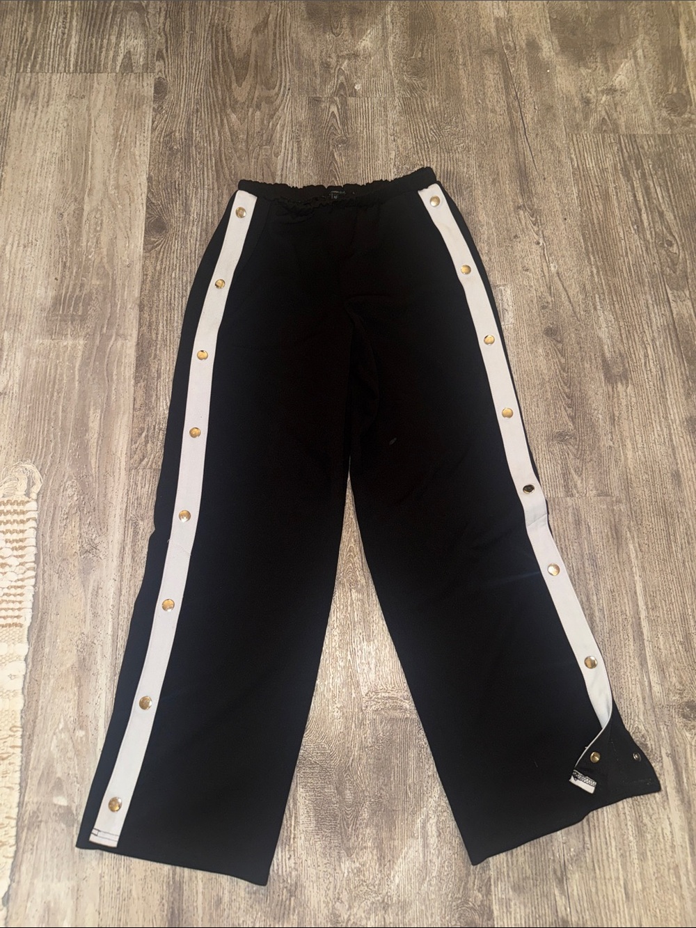 Takara Black Wide-Leg Track Pants with White Side Stripes and Gold Snaps